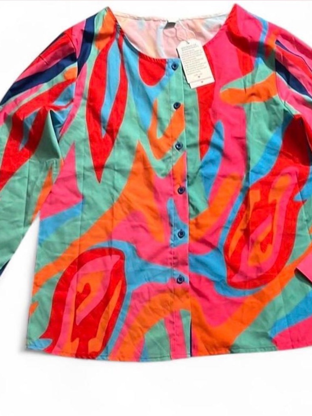 Woman’s psychedelic print button up top and skirt